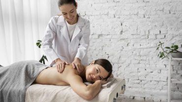 Side view woman getting massaged spa